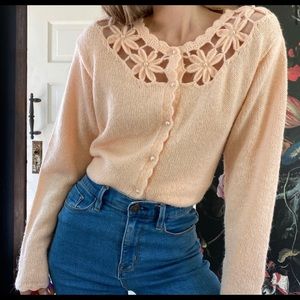 Light pink/peach sweater with knots flowers and pearl buttons